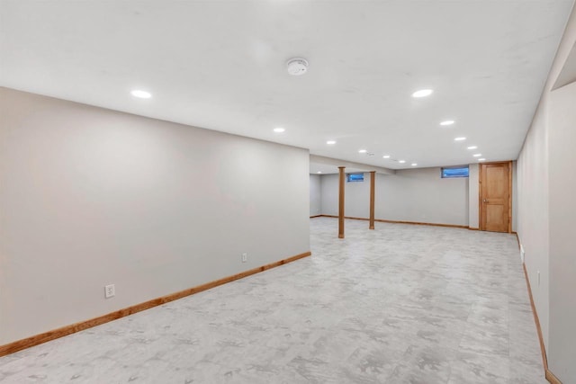 finished basement with recessed lighting and baseboards