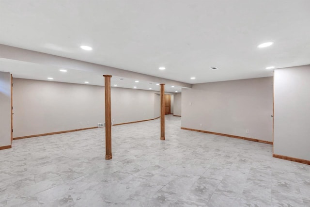 finished basement featuring visible vents, recessed lighting, and baseboards