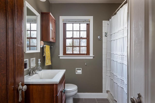 bathroom with vanity, a shower with curtain, baseboards, tile patterned flooring, and toilet