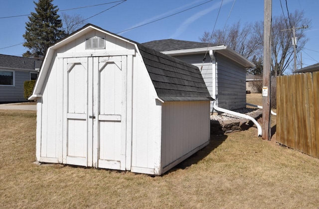 view of shed with fence