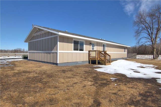 back of property with board and batten siding