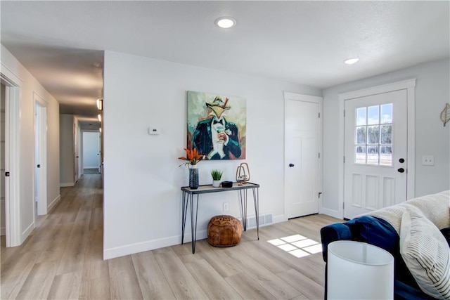 entrance foyer with visible vents, recessed lighting, baseboards, and light wood-type flooring