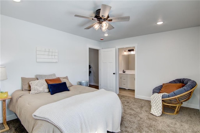 carpeted bedroom with recessed lighting, baseboards, and connected bathroom