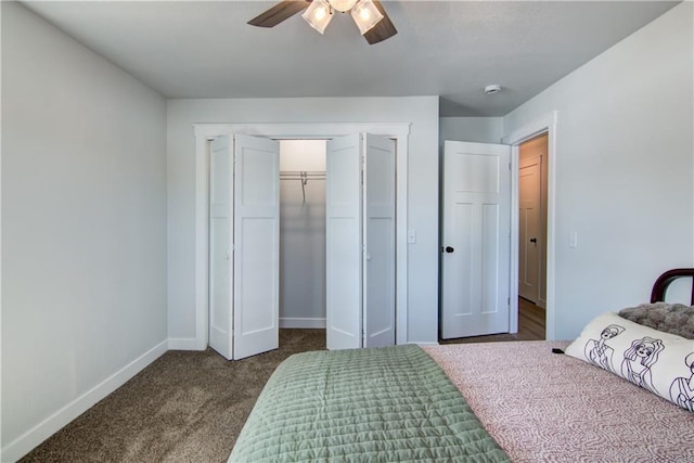 bedroom featuring a ceiling fan, baseboards, a closet, and dark colored carpet