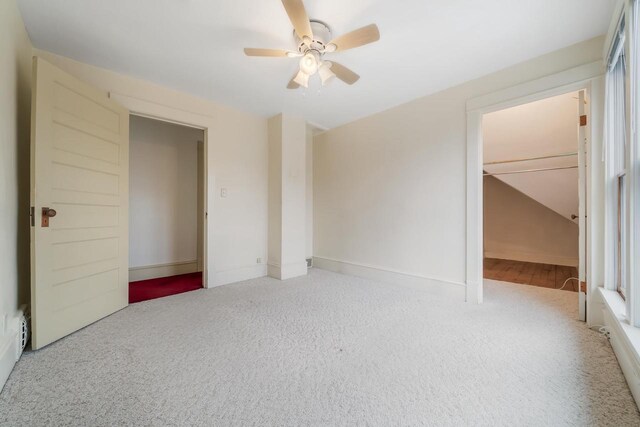 unfurnished bedroom featuring baseboards, carpet, and ceiling fan