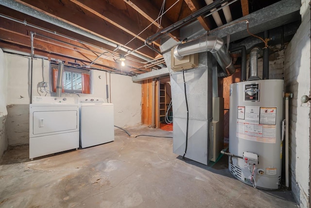 below grade area featuring gas water heater, heating unit, and washing machine and dryer