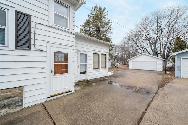 exterior space with a detached garage