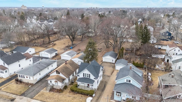 birds eye view of property with a residential view