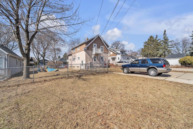 exterior space with driveway and fence