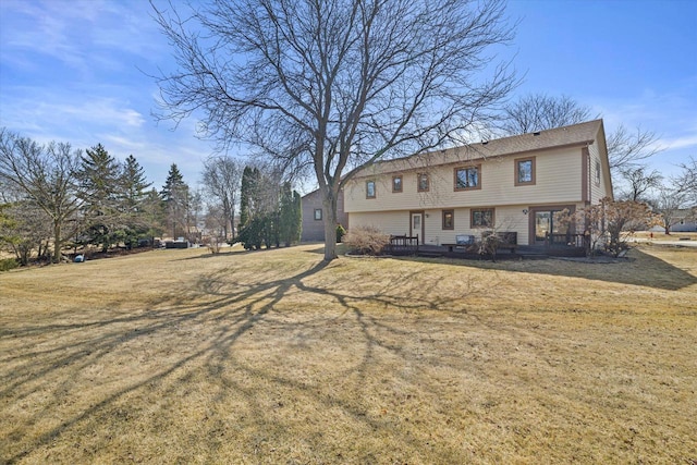 back of property featuring a yard