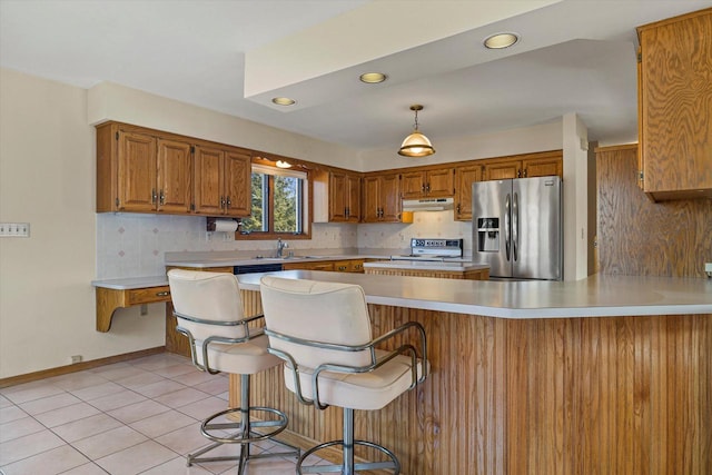 kitchen with stainless steel refrigerator with ice dispenser, under cabinet range hood, electric range oven, a peninsula, and light countertops