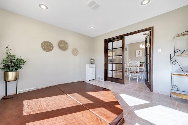 interior space with light tile patterned floors, visible vents, and recessed lighting