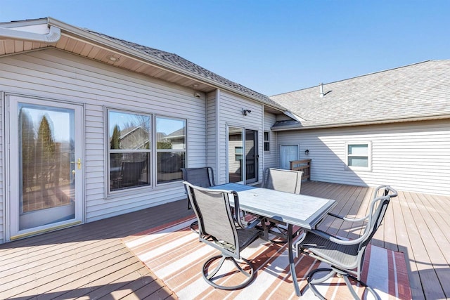 wooden terrace featuring outdoor dining area