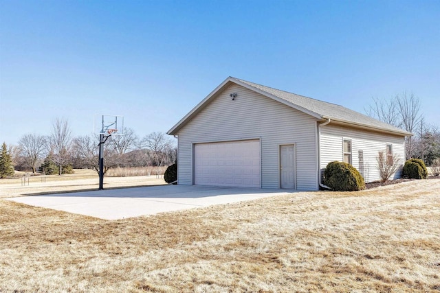 view of home's exterior with an outbuilding and a garage