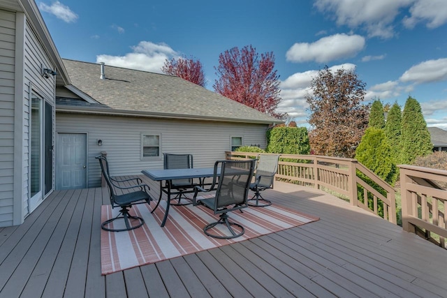 wooden terrace with outdoor dining space