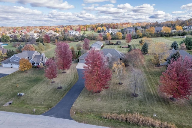 birds eye view of property with a residential view