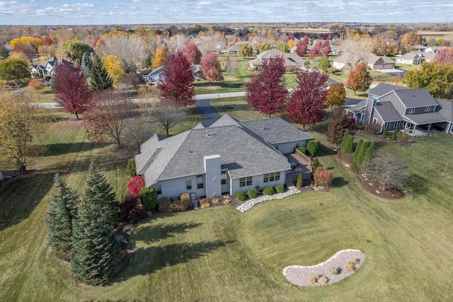 birds eye view of property with a residential view