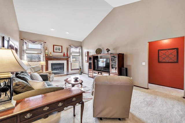 living room with a premium fireplace, baseboards, light colored carpet, and high vaulted ceiling