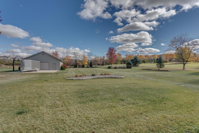 view of yard with an outbuilding and a detached garage