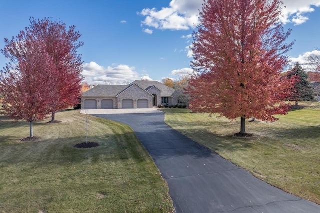 french country inspired facade featuring aphalt driveway, stone siding, and a front lawn