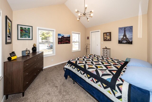 bedroom with baseboards, carpet, vaulted ceiling, an inviting chandelier, and a closet