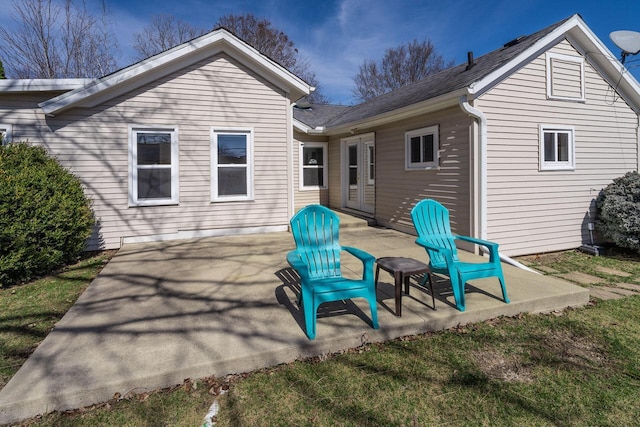 rear view of property featuring a patio area