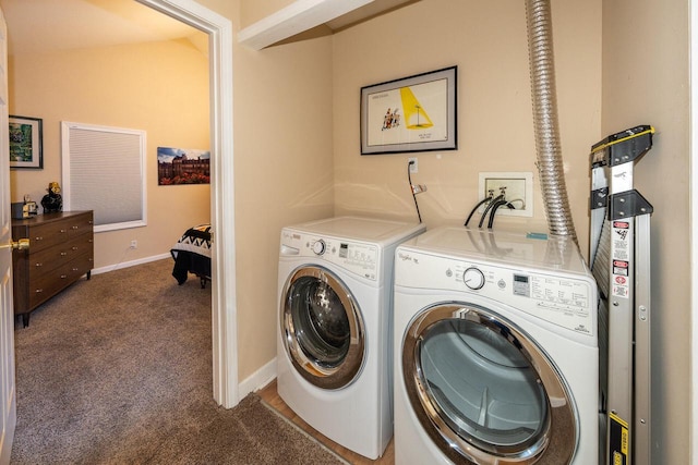 washroom featuring washer and dryer, carpet flooring, baseboards, and laundry area