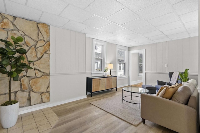 living area featuring baseboards and wood finished floors