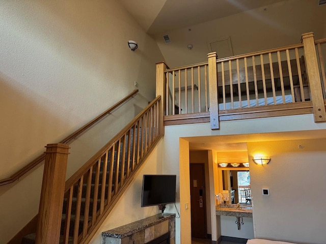 stairs with a towering ceiling