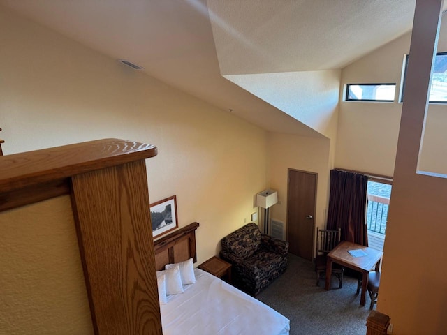 bedroom with visible vents, multiple windows, high vaulted ceiling, and carpet flooring