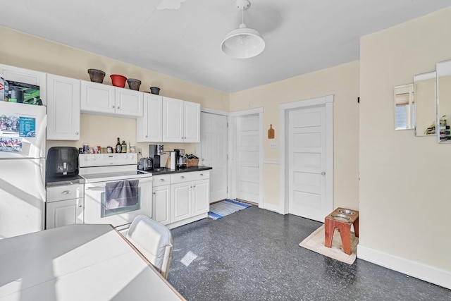 kitchen with baseboards, white appliances, dark countertops, and white cabinets