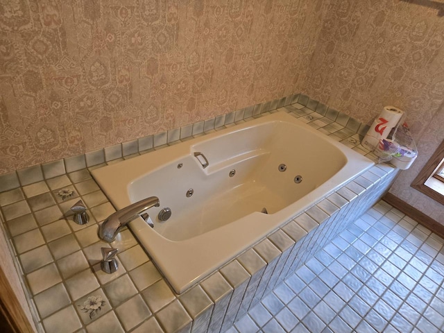 bathroom featuring tile patterned floors, a jetted tub, wallpapered walls, and baseboards