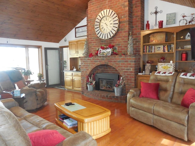 living room with lofted ceiling, light wood-style floors, wood ceiling, and a fireplace