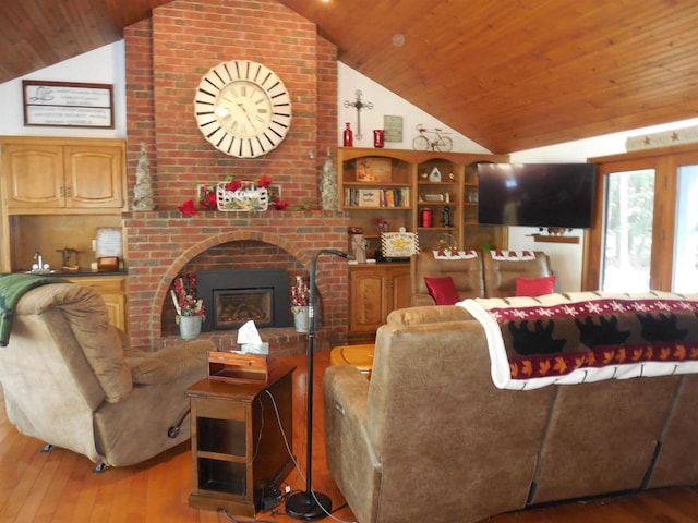 living room featuring hardwood / wood-style floors, vaulted ceiling, a brick fireplace, and wood ceiling