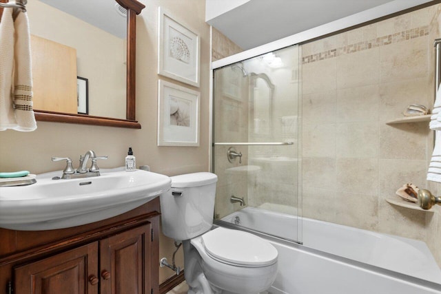 full bathroom with vanity, toilet, and enclosed tub / shower combo