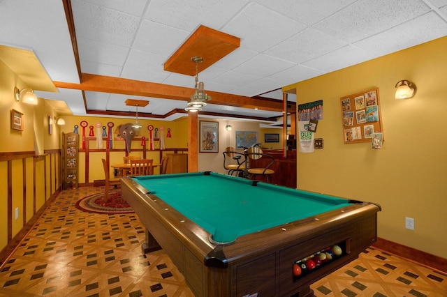 playroom featuring a paneled ceiling, bar area, billiards, and baseboards