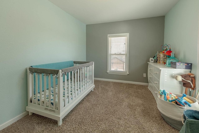 bedroom featuring carpet flooring and baseboards