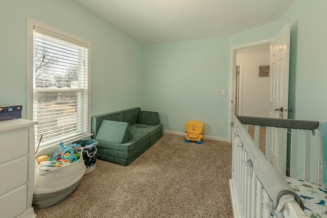 playroom featuring baseboards and carpet floors