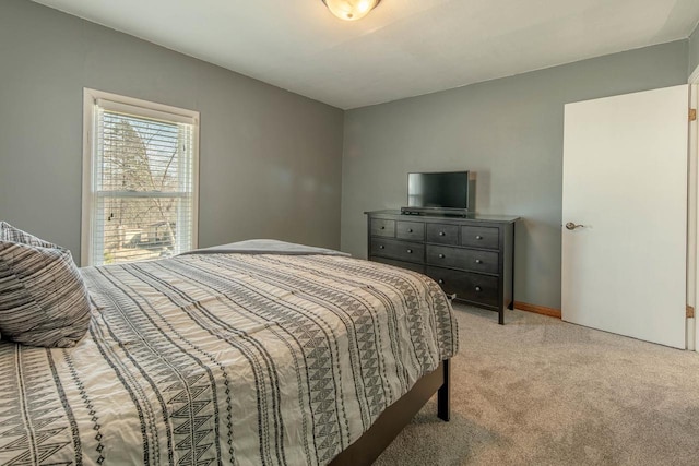 bedroom featuring light carpet