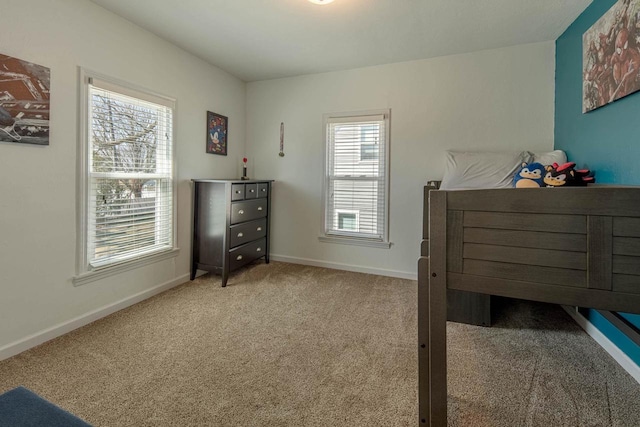 bedroom featuring baseboards and carpet floors