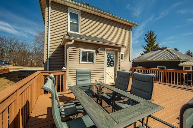 deck with outdoor dining area