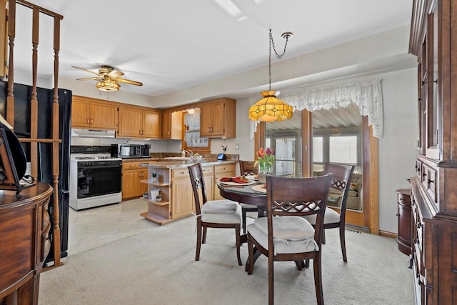 dining area with a ceiling fan