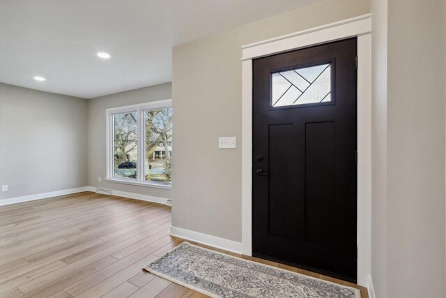 entryway with visible vents, recessed lighting, baseboards, and wood finished floors