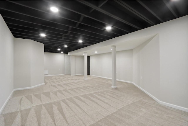 finished below grade area featuring recessed lighting, carpet, and baseboards