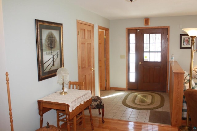 entryway with wood finished floors