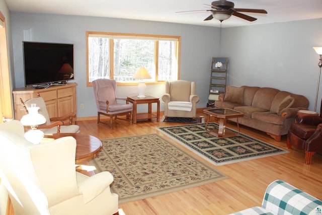 living room featuring a ceiling fan and wood finished floors