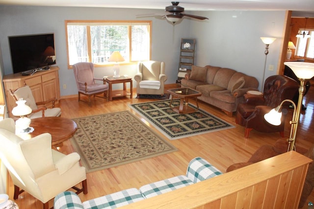 living room with ceiling fan and wood finished floors