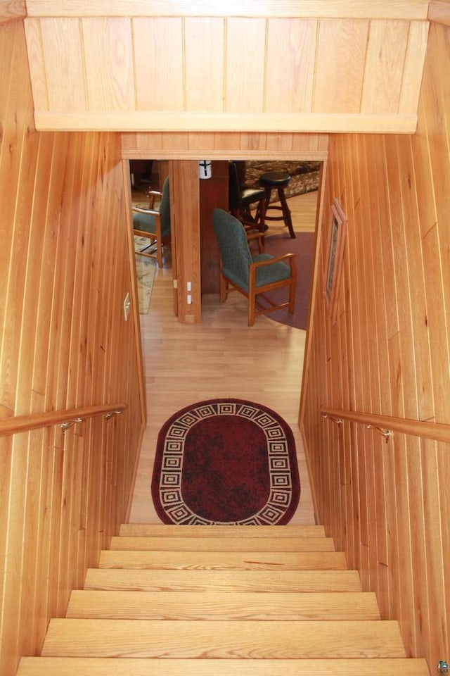 staircase with wood finished floors