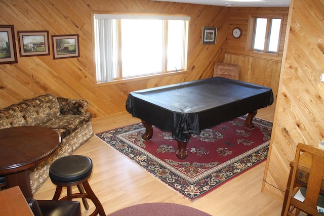 recreation room with wooden walls, billiards, and wood finished floors