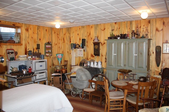 bedroom featuring wooden walls